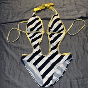 Large swimsuit with gold trimmings